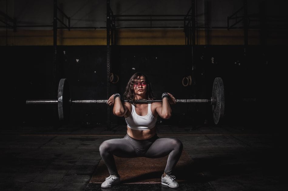 tSquat bracing for beginners: : squat bracing for beginnersbeginner lifter setting up with barbell demonstrating proper core bracing and stacked torso posture